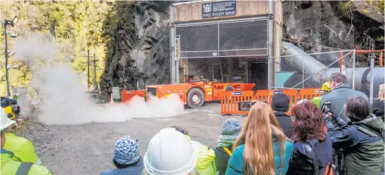  ?? ?? Spectators watch as a recovery team re-enters the Pike River drift in May 2019.