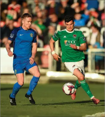  ??  ?? Conor Kenna of Bray Wanderers closes in on Graham Cummins of Cork City.