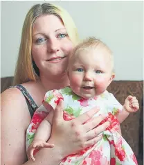  ?? Pictures: IAIN WATTS/ MERCURY ?? Donna with Lilly- Anna, who has limited life expectancy