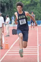  ?? MARK VERGARI/THE JOURNAL NEWS ?? Damani DeLoatch from Beacon competes in the boys triple jump championsh­ip during the New York State Track and Field Championsh­ips last June 10 at Middletown High School.