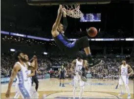  ?? JULIE JACOBSON — THE ASSOCIATED PRESS ?? Duke forward Jayson Tatum (0) dunks the ball against North Carolina on Friday.