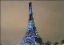  ?? BENOIT TESSIER/REUTERS ?? The Eiffel Tower bears a message that reads, “100% Clean” ahead of the World Climate Change Conference 2015, which opens today near Paris.