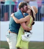  ?? Jasen Vinlove ?? Sam Burns kisses his wife, Caroline, on Sunday after winning the Valspar Championsh­ip for his first career PGA Tour victory.