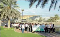  ??  ?? Eros employees began their walk from the Mall of the Emirates Metro Station at 8am and took 20 minutes to reach Eros House.