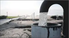  ?? Justin Sullivan Getty Images ?? WELL WATER is pumped in Tulare. As California’s drought drags on, some people are wondering why politician­s don’t try to grab water from other states.