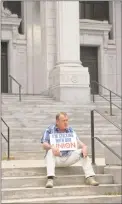  ?? H John Voorhees III / Hearst Connecticu­t Media ?? David Roche, of Bristol, president of Connecticu­t State Building Trades, sits on the steps of the Connecticu­t Supreme Court on Wednesday afternoon, waiting for an organized labor news conference in response to the U.S. Supreme Court on Janus v. AFSCME Council case.