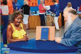  ?? COURTESY OF JEFF DUNN FOR WGBH ?? Ken Sanders, right, appraises a Madam C.J. Walker beauty book, ca. 1920, in Kansas City, Missouri, during an episode of “Antiques Roadshow.” Sanders will be at the 2023 Albuquerqu­e Antiquaria­n Book Fair.