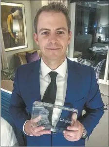  ??  ?? Former Dubbo Photo News sports reporter Matt Logue with his national award for NBL coverage. PHOTO: SUPPLIED