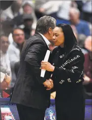  ?? Jessica Hill / Associated Press ?? UConn coach Geno Auriemma, left, and South Carolina coach Dawn Staley shake hands at the end of Monday’s 97-79 win by the Huskies in Hartford.