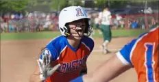 ?? Emily Matthews/Post-Gazette ?? Armstrong’s Emma Smerick celebrates after scoring during the WPIAL Class 5A softball championsh­ip on Friday in California, Pa. Armstrong won, 6-5.