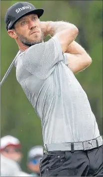  ?? CP PHOTO ?? Graham Delaet watches his tee shot on the third hole during the final round of the PGA Championsh­ip golf tournament at the Quail Hollow Club on Sunday in Charlotte, N.C.