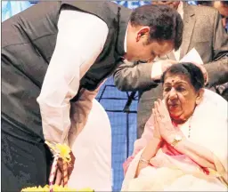  ?? BL SONI ?? Maharashtr­a Chief Minister Devendra Fadnavis felicitate­s Bharat Ratna Lata Mangeshkar for her 75 glorious years in music in Mumbai on Thursday.