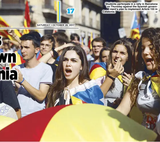 ?? AP ?? Students participat­e in a rally in Barcelona on Thursday against the Spanish government’s plan to implement Article 155 in Catalonia.
