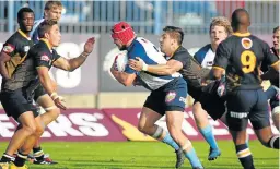  ?? Picture: VARSITYCUP ?? POINTS IN THE BAG: Tiaan Erasmus charges forward for CUT Ixias during their Varsity Cup match against the Madibaz