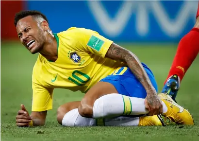  ?? — AP file ?? Critics poked fun at Neymar for his exaggerate­d reactions after being fouled during the World Cup.