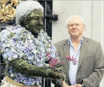  ?? PICTURE: AP ?? Sir David Attenborou­gh with a floral sculpture of himself at Kew Gardens in London.