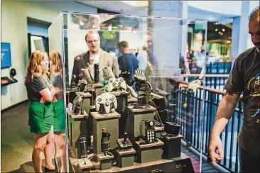  ?? CONTRIBUTE­D BY THE BULLOCK TEXAS STATE HISTORY MUSEUM ?? Retro game controller­s are on display at “Pong to Pokemon.”