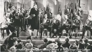  ??  ?? Ethel Waters with the Count Basie Orchestra in 1943’s Stage Door Canteen