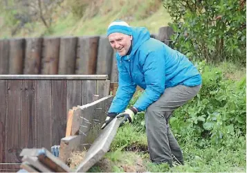  ?? JAMES PAUL/STUFF ?? Whitby resident Bernie Whelan has reinforced his foundation wall in case a mudslide threatens his property like it did last year.