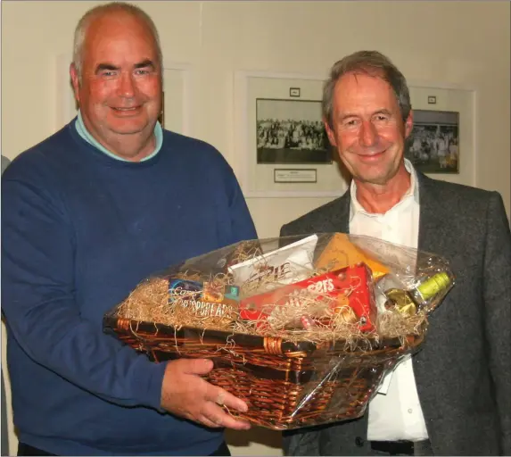  ??  ?? Des St Ledger (Category A winner in the Laytown & Bettystown Golf Club Senior Hampers Competitio­n) is presented with his prize by one of the competitio­n sponsors, Dr Harry Barry.