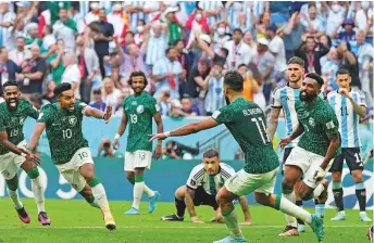  ?? AP ?? Saudi Arabia’s Salem Al Dawsari, second left, celebrates after scoring his side’s second goal during the World Cup group C match against Argentina at the Lusail Stadium yesterday.