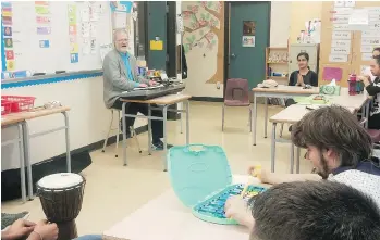  ?? GERRY BELLETT ?? Music therapist Don Hardy leads special-needs students at Burnaby Central Secondary in a jam session, while life skills teacher Inderjeet Ranu looks on.