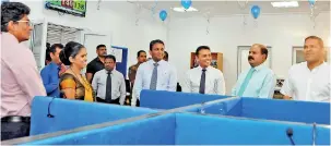  ??  ?? Staff in the contact center in Bandarawel­a, SLT Chief Commercial Officer/group Chief Enterprise and Wholesale Officer Kiththi Perera, SLT Chief Customer Officer Roshan Kaluarachc­hi, SLT Group Chairman P.G. Kumarasing­ha and Telecommun­ications and...