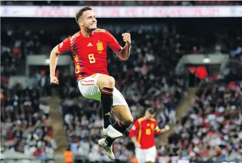  ?? — THE ASSOCIATED PRESS ?? Spain’s Saul Niguez celebrates after scoring his team’s first goal and his first internatio­nal goal in the UEFA Nations League soccer match between England and Spain at Wembley Stadium in London on Saturday.