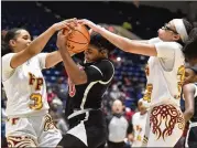  ?? AJC 2021 ?? No. 1 Woodward Academy’s Zoe Scott (center) holds on as Forest Park’s Jasmine Stevens (3) and Yasmine Allen try to steal.