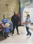  ??  ?? GRUBS UP: Mr Johal with Calderdale Royal Hospital staff.