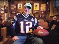  ?? Robert F. Bukaty / Associated Press ?? Don Crisman poses at his home on Wednesday in Kennebunk, Maine. Crisman is one of three fans who have attended every Super Bowl. This year the trio will have to work coronaviru­s-era precaution­s into the trip.