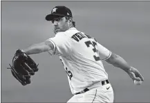  ?? DAVID J. PHILLIP/AP PHOTO ?? In this July 24 file photo, Houston Astros starting pitcher Justin Verlander throws against the Seattle Mariners.