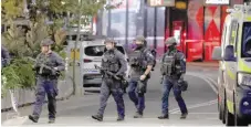  ?? — AFP ?? Police patrol in front of the Westfield Bondi Junction shopping mall after a stabbing incident in Sydney.