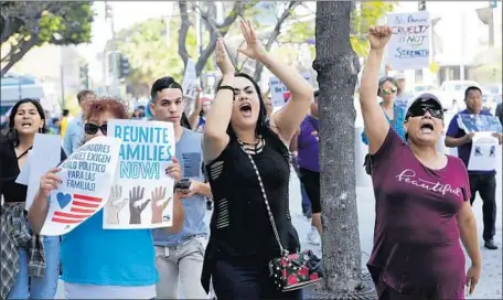  ?? Mel Melcon Los Angeles Times ?? ELIZABETH CASTILLO, center, and Patricia Garcia, right, of El Monte protest family separation­s at a downtown L.A. march last week.