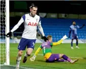  ?? — AP ?? Tottenham’s Gareth Bale celebrates after scoring against Wycombe in their FA Cup fourth round match in High Wycombe, England, on Monday.