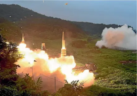  ??  ?? United States and South Korean forces fire missiles into the East Sea yesterday during a joint drill aimed at countering North Korea’s latest test of an interconti­nental ballistic missile.