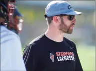  ?? Matthew Brown / Hearst Connecticu­t Media ?? Stamford coach Mike Nazzaro watches the action develop in the first half of a boys lacrosse game against Fairfield Warde at Stamford High School on May 7, 2019 in Stamford. Nazzaro is extremely proud of how far the Stamford city lacrosse feeder program has come, leaving him with plenty of experience­d players coming out for the team even with a year off due to the pandemic.