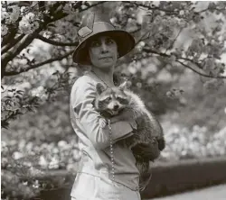  ??  ?? ABOVE:
First Lady Grace Coolidge with Rebecca the Raccoon in 1926.