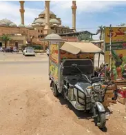  ?? ?? a fruit seller’s electric tuk-tuk is parked outside al-noor Islamic Complex in the sudanese capital’s northern district of Khartoum-bahri, recently.