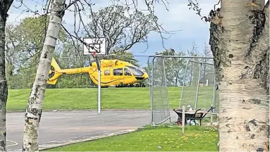  ?? ?? Response Air ambulance lands at Kyle Academy after a 60-year-old man dies while fallingint­o the River Ayr