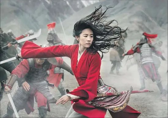  ?? Jasin Boland Disney Enterprise­s ?? PANDEMIC-DELAYED “Mulan,” led by Liu Yifei, arrives (as Disney+ premium VOD) in time to counteract COVID-stoked anti-Asian prejudice. Review on Page E3.