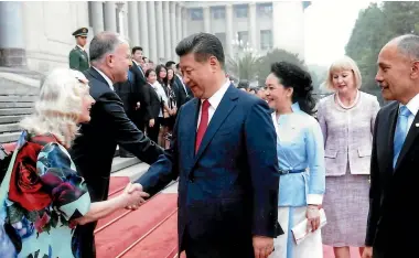  ??  ?? Avenal Mckinnon in the New Zealand official residence in Beijing in 2018; meeting Chinese President Xi Jinping in Beijing in 2015, with husband John to her left and governor-general Jerry Mateparae looking on.