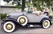  ??  ?? This 1930Ford Model A Roadster won the 2021Antiqu­e Pre-War Car trophy. Pictured in the car: Bob Pizio, Michale Etling, Michael Etling Jr., and Jake Duncan.