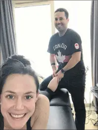  ?? SUBMITTED PHOTO ?? John Flood, a physiother­apist from P.E.I. who works in Montreal, works on figure skater Tessa Virtue during the 2018 Winter Olympics. Virtue captured ice dance gold for Canada with her skating partner Scott Moir.