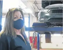  ?? DANIEL BROWN • LOCAL JOURNALISM INITIATIVE REPORTER ?? Lisa MacIntyre, owner of Her Man’s Shop, stands in her auto shop in Morell on Jan. 21.