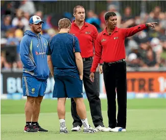  ?? PHOTO: PHOTOSPORT ?? Aaron Finch and Kane Williamson meet the umpires during the washed out ODI against Australia in February last year.