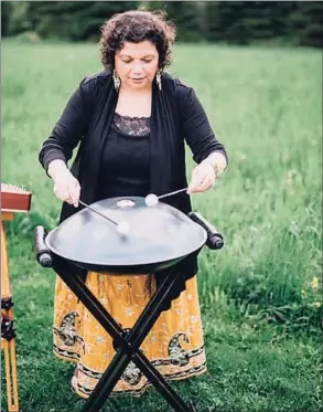  ?? Corey Lynn Tucker Photograph­y / Contribute­d photo ?? Thomasina Levy playing a hand drum.