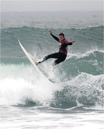  ??  ?? WELL-BALANCED: Kyle Ruben shows his style for the Billabong Madibaz in the University Sport South Africa surfing championsh­ips in Port Elizabeth last weekend. Madibaz were runners-up overall, just eight points behind UCT