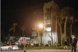  ?? PHOTOS BY ANDRES LEIVA / THE PALM BEACH POST ?? Churchgoer­s leave Bethesda-by-the-Sea Episcopal Church in Palm Beach after the late-night Christmas Eve service. President Donald Trump and his wife, first lady Melania Trump, were in attendance.