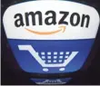  ?? LIONEL BONAVENTUR­E, AFP/GETTY IMAGES ?? Amazon said it is committed to making food accessible through online grocery shopping by offering all customers the lowest prices possible.